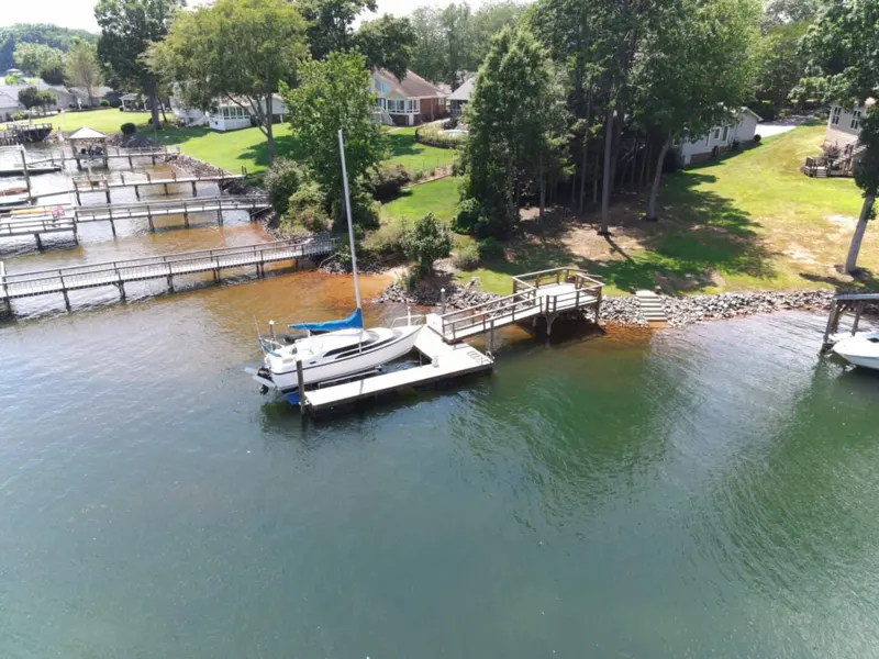 Aerial view of a private dock and boat lift on Lake Norman