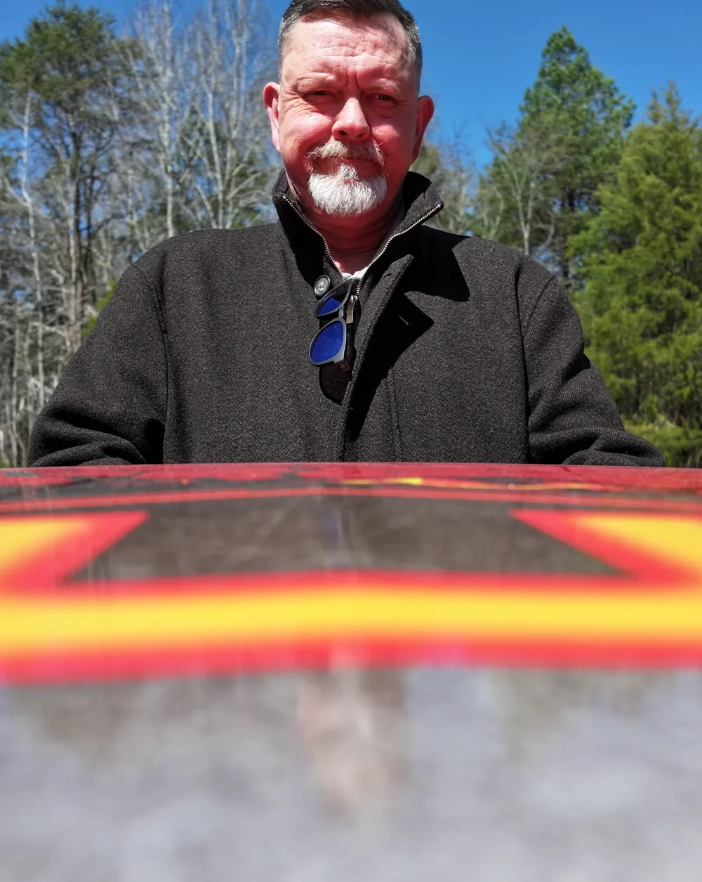 Carl Holt, founder of Perspectives Multimedia, standing behind a drone landing pad