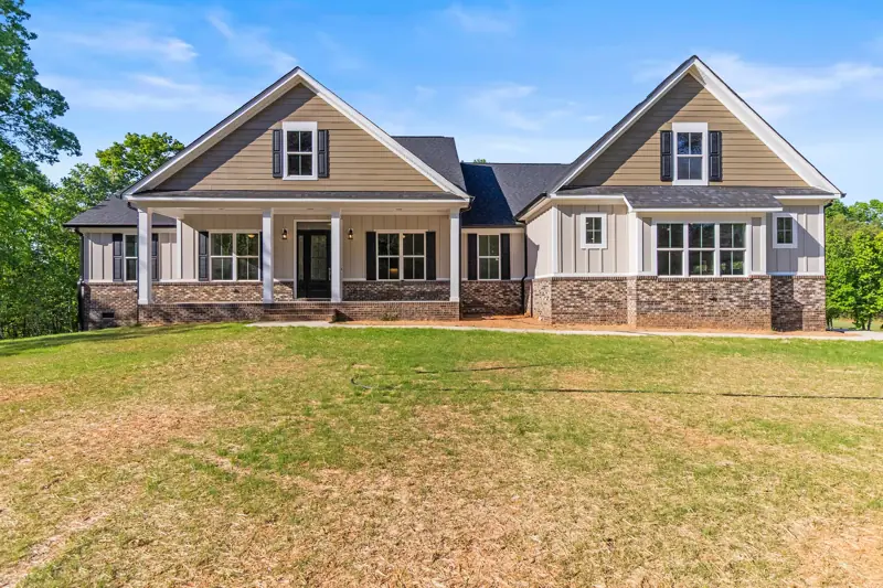 New construction home with board-and-batten gables