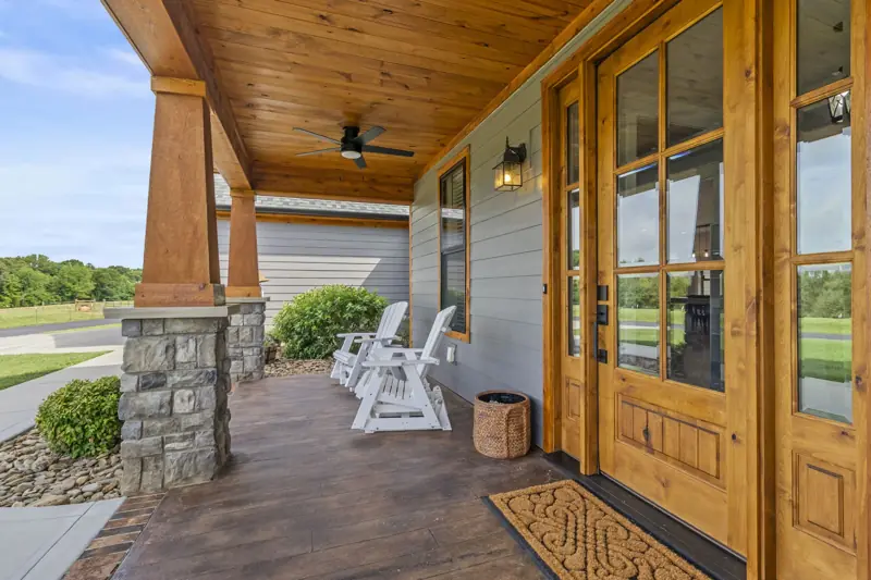 Timber-framed porch with double wood entry doors