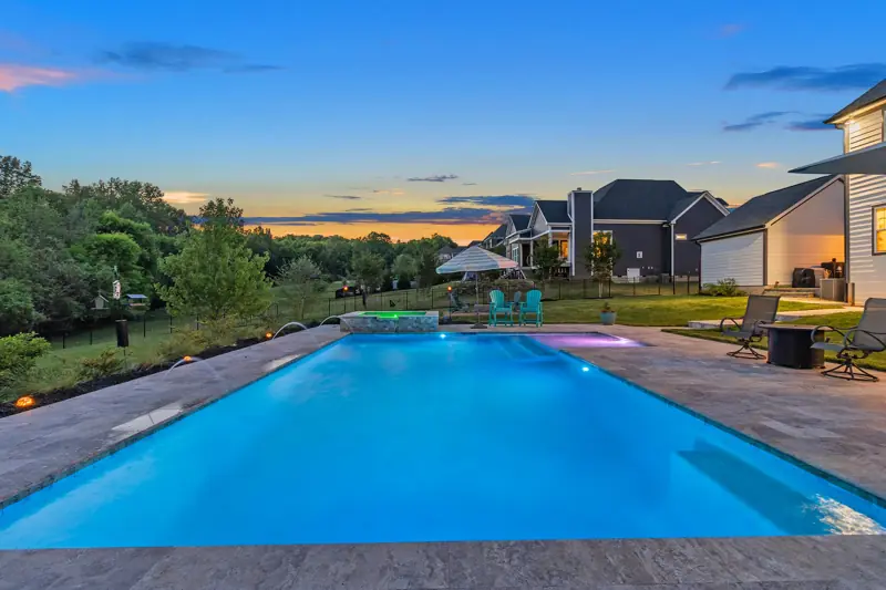 Pool at sunset with pink and blue sky